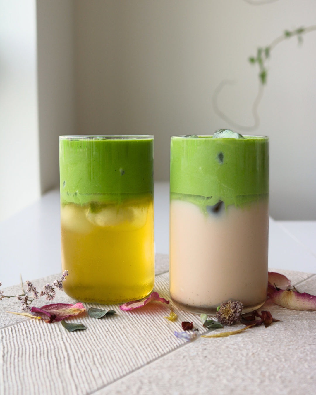 Jasmine cold brew tea with salted matcha foam and jasmine cold brew milk with salted matcha foam